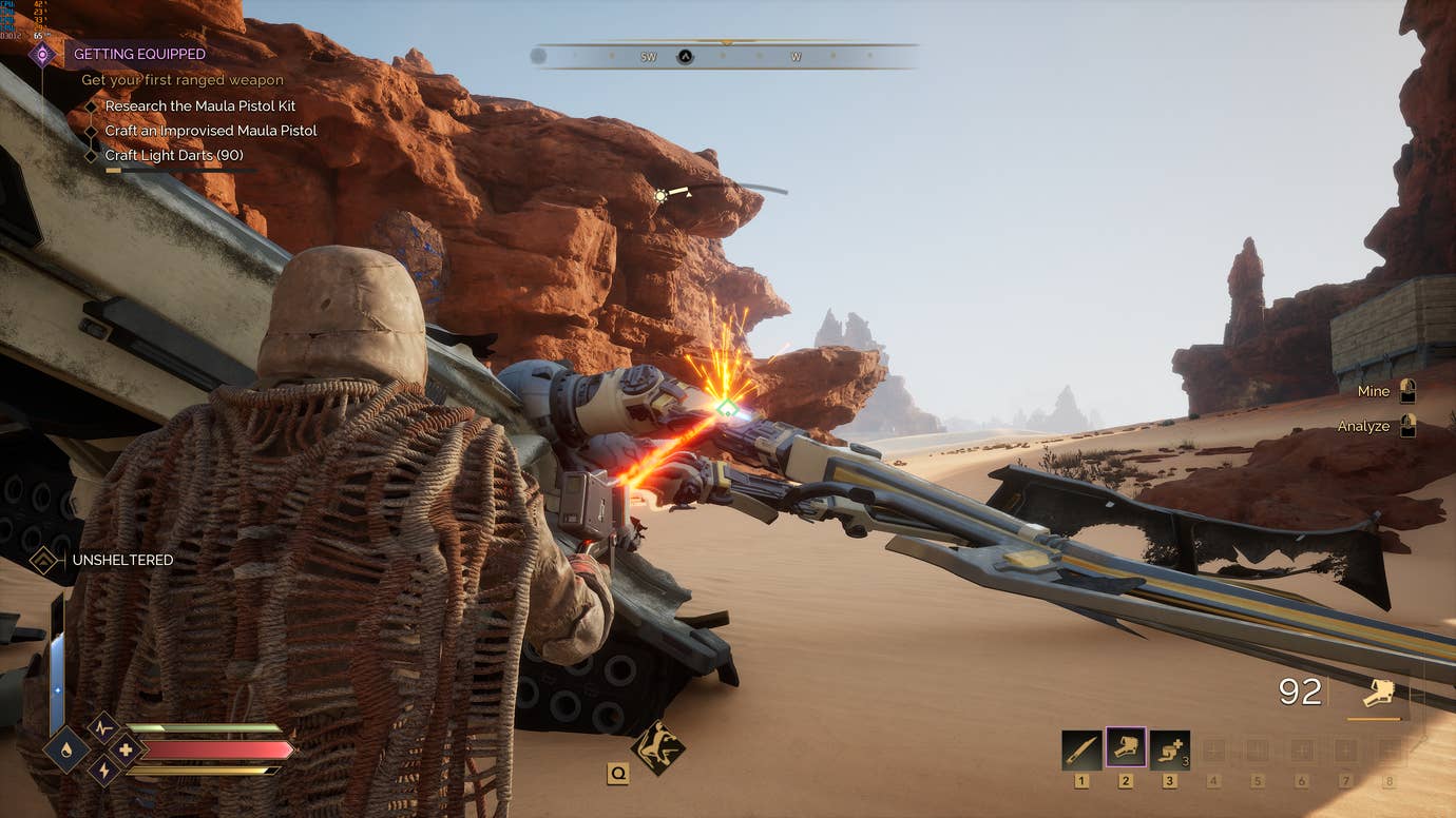 Laser-cutting some scrap metal off a downed ornithopter in Dune: Awakening.